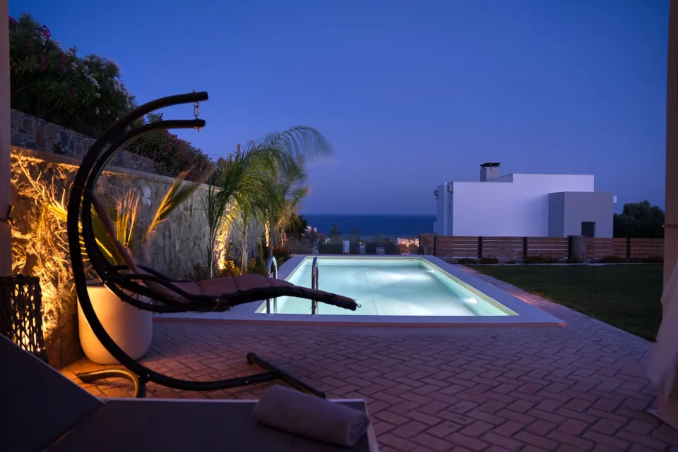Aelia Illuminated Pool at Dusk